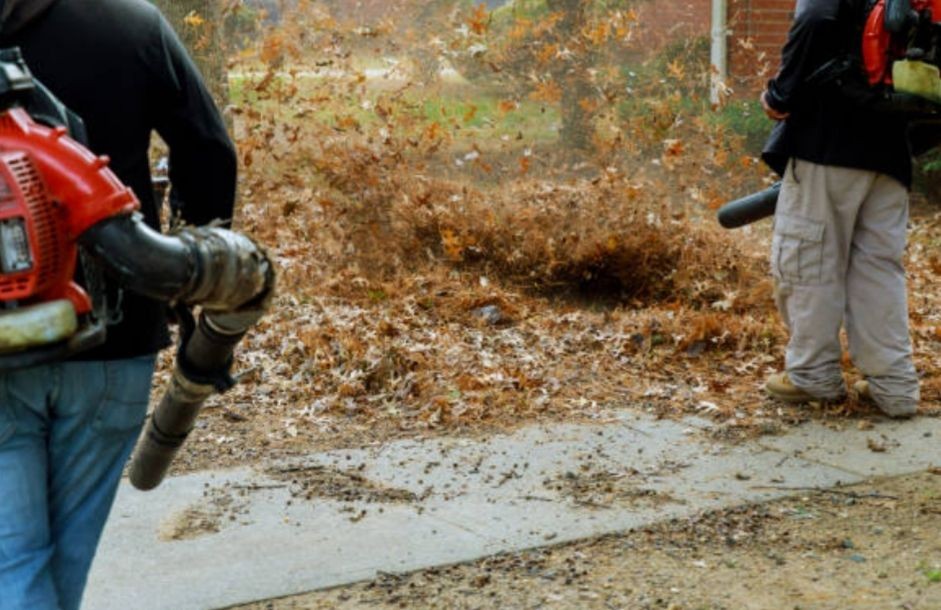 man with leaf blower blowing leafs