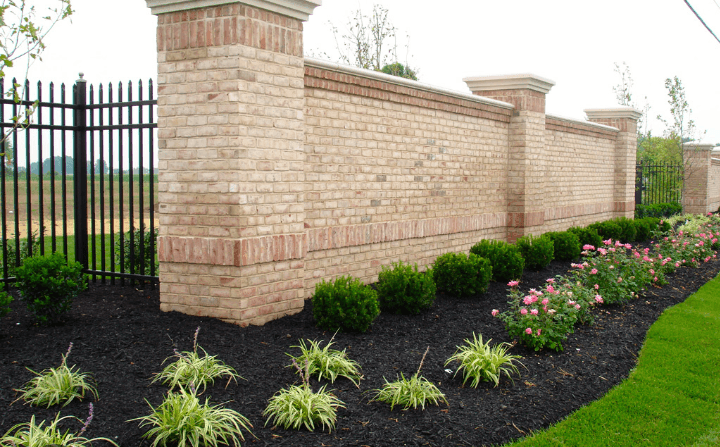 black mulch in garden bed wut wall